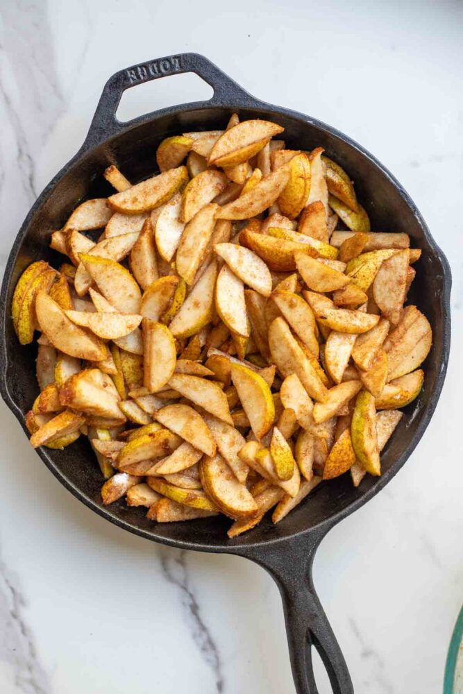 Pear filling in a cast iron skillet.