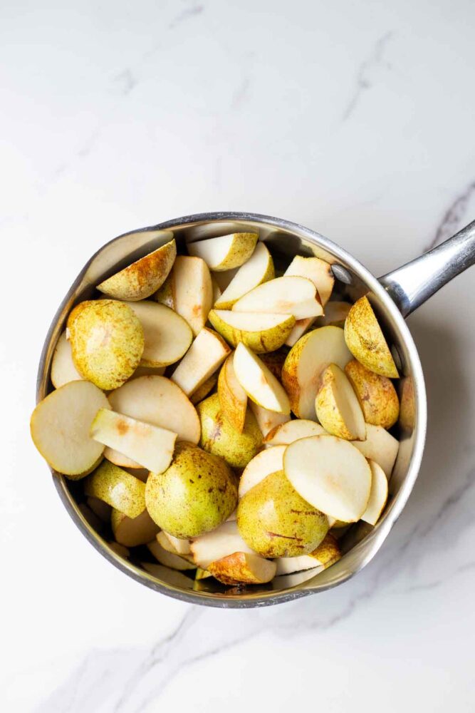 Sliced pears in a pot. 