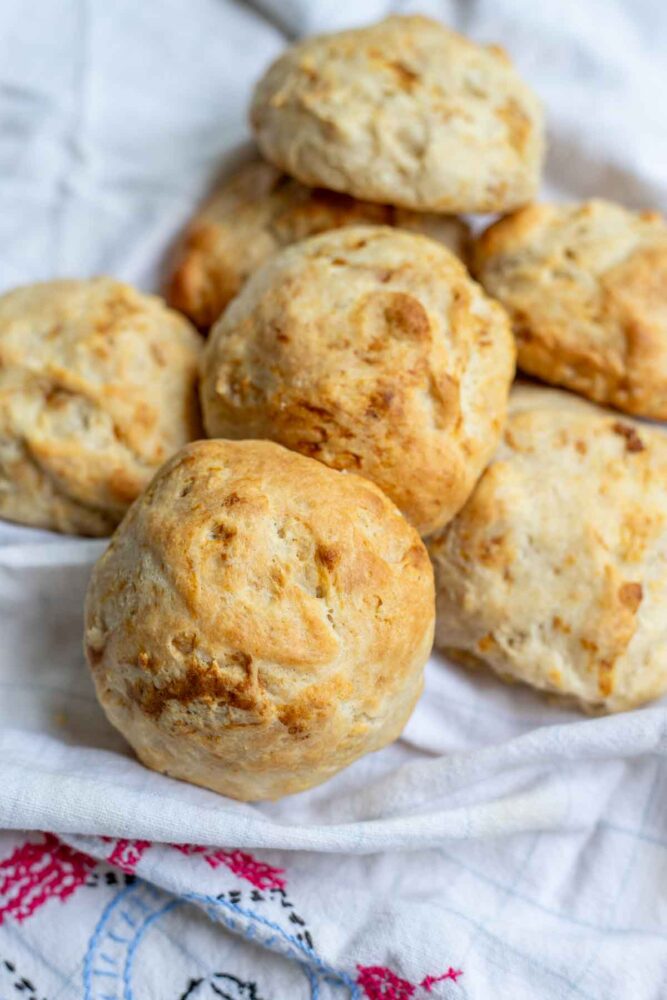 Sourdough drop biscuits on a vintage tea towel.