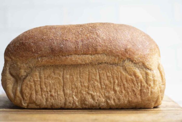 Loaf of whole wheat sourdough bread fresh out of the oven.