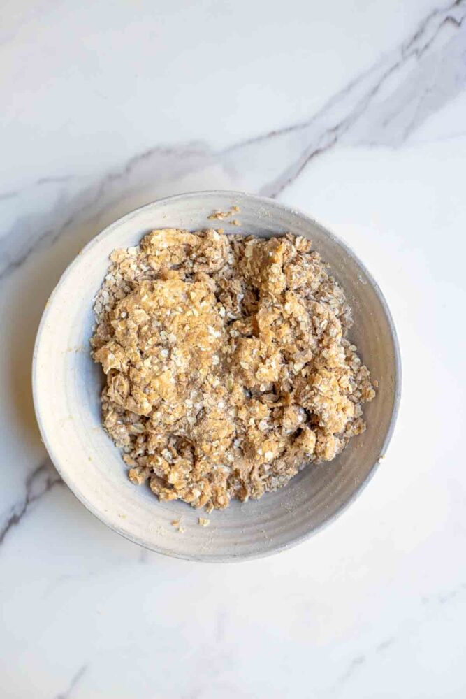 Oat crisp topping in a white bowl.