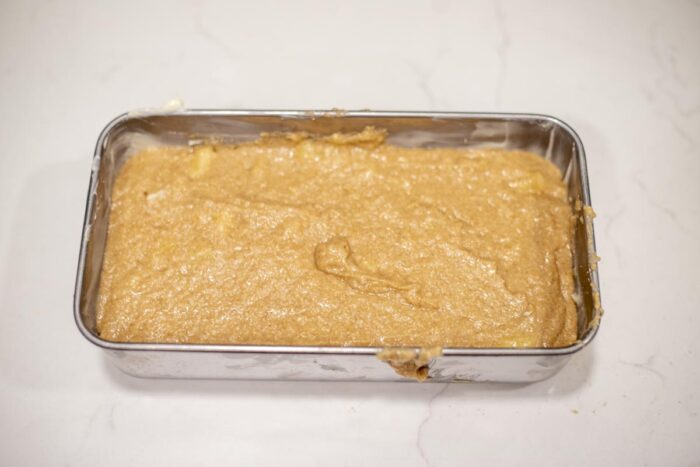 banana bread batter in a loaf pan.