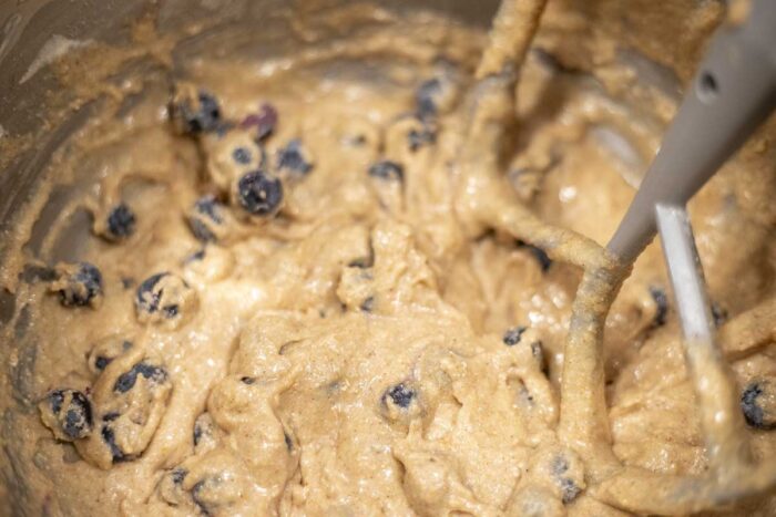 sourdough blueberry muffin batter in a stand mixer with paddle attachment.