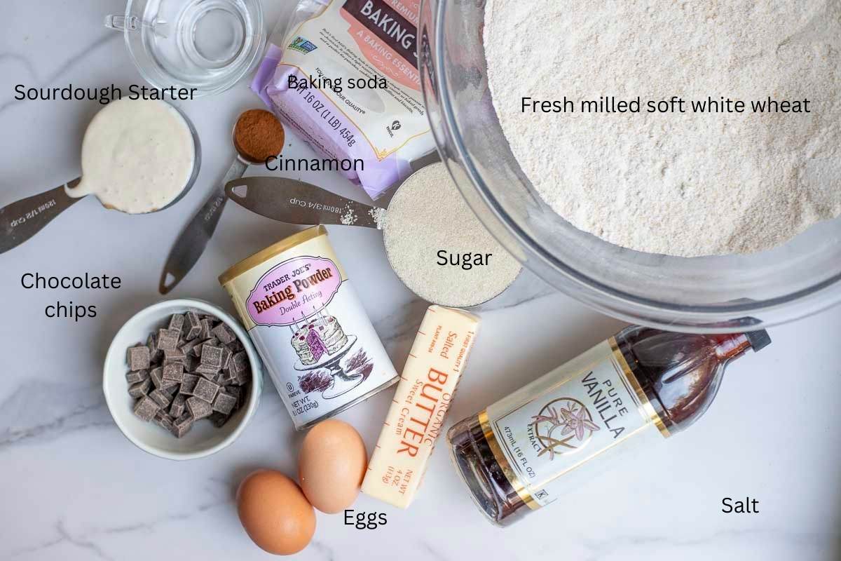 eggs, butter, flour, sourdough starter, and other ingredients on a countertop.