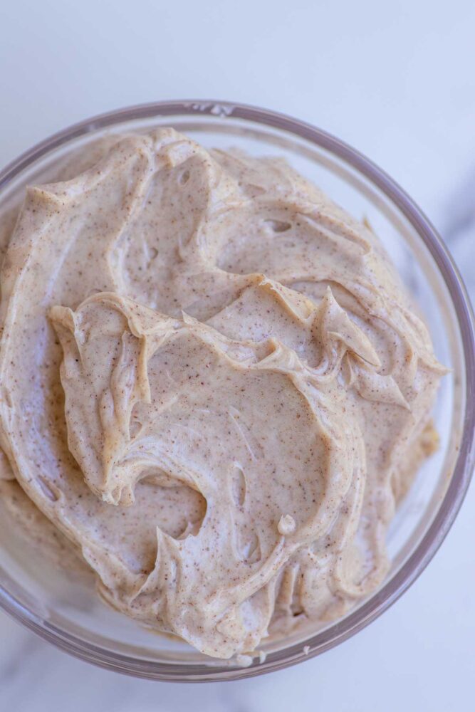 Overhead photo of honey cinnamon butter in a glass bowl.