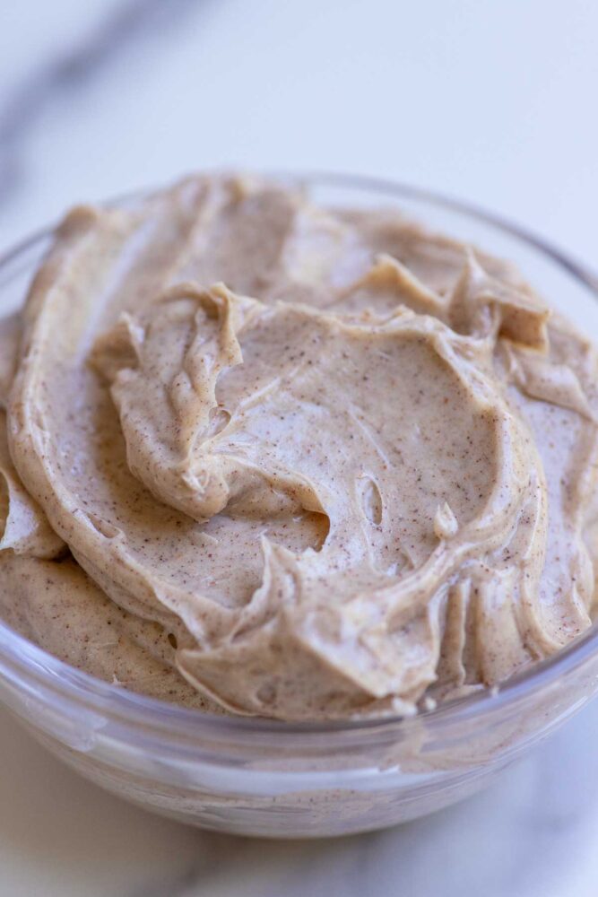 Cinnamon honey butter in a glass bowl.