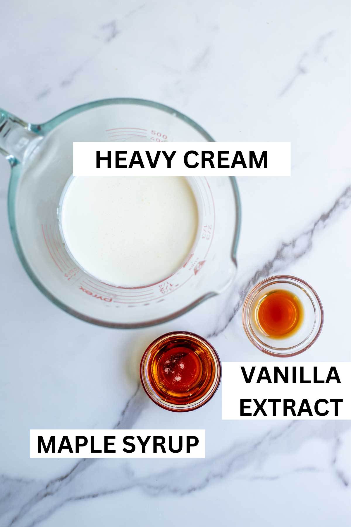 Whipped cream, maple syrup, and vanilla extract in bowls.