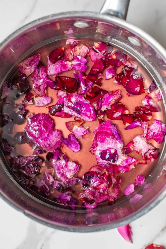 Rose petals simmering in a simple syrup.