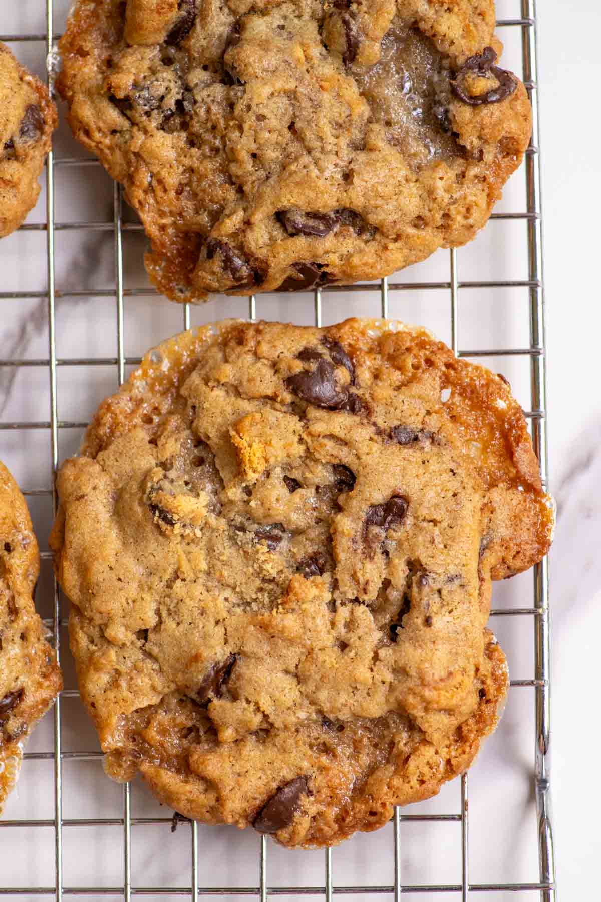 A close up picture of a sourdough s'mores cookie on a cooling rack.