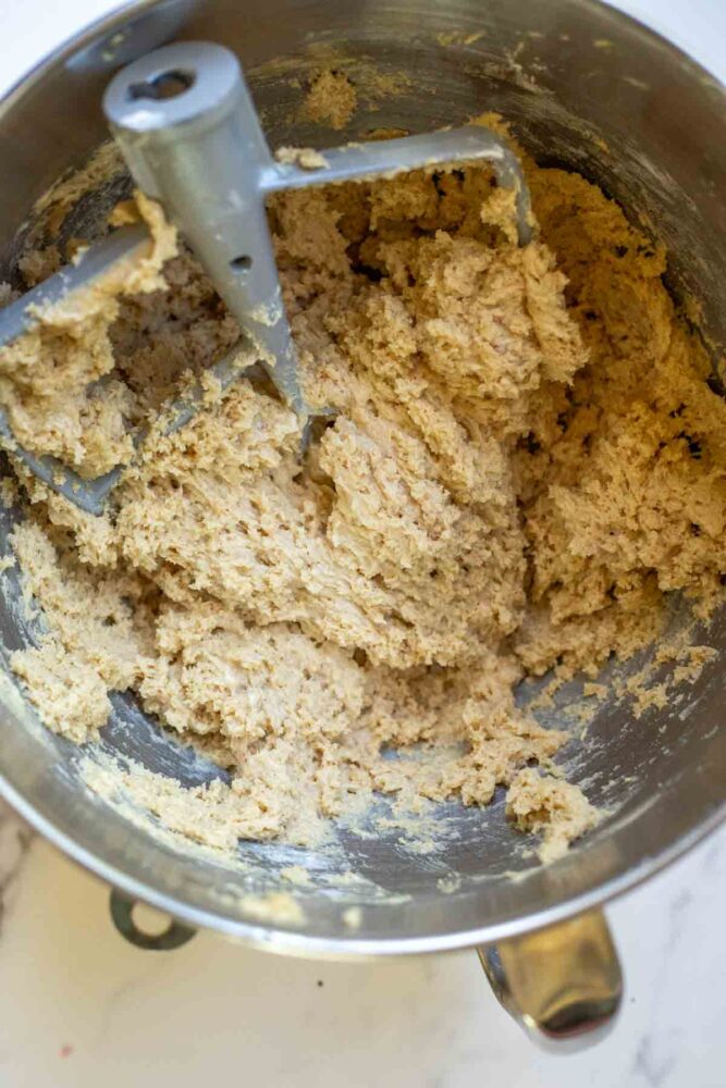 browned butter cookie dough batter in a stand mixer bowl.