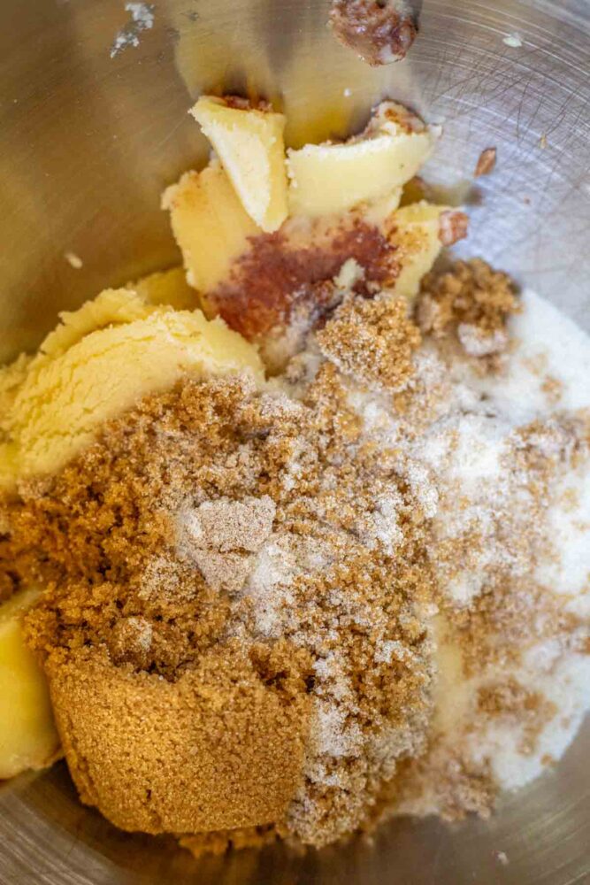 Sugar, brown sugar, and browned butter in a stand mixer bowl.