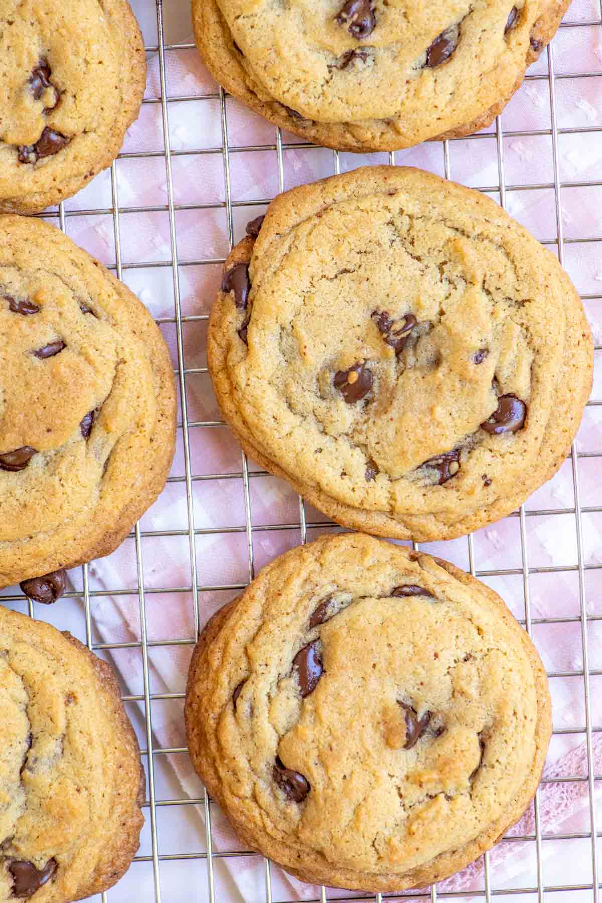 Browned butter sourdough chocolate chip cookies cooking on a cooling rack.