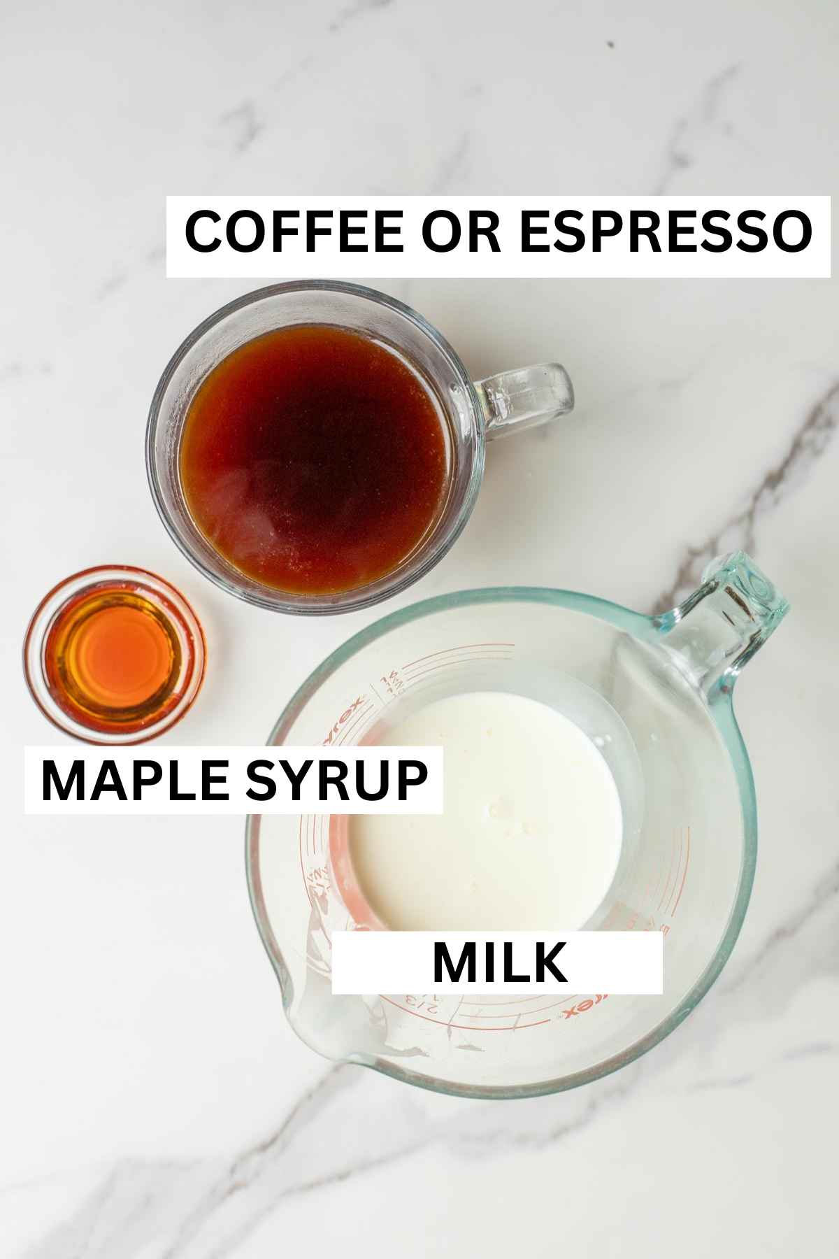 strong coffee, maple syrup, and milk on a countertop.