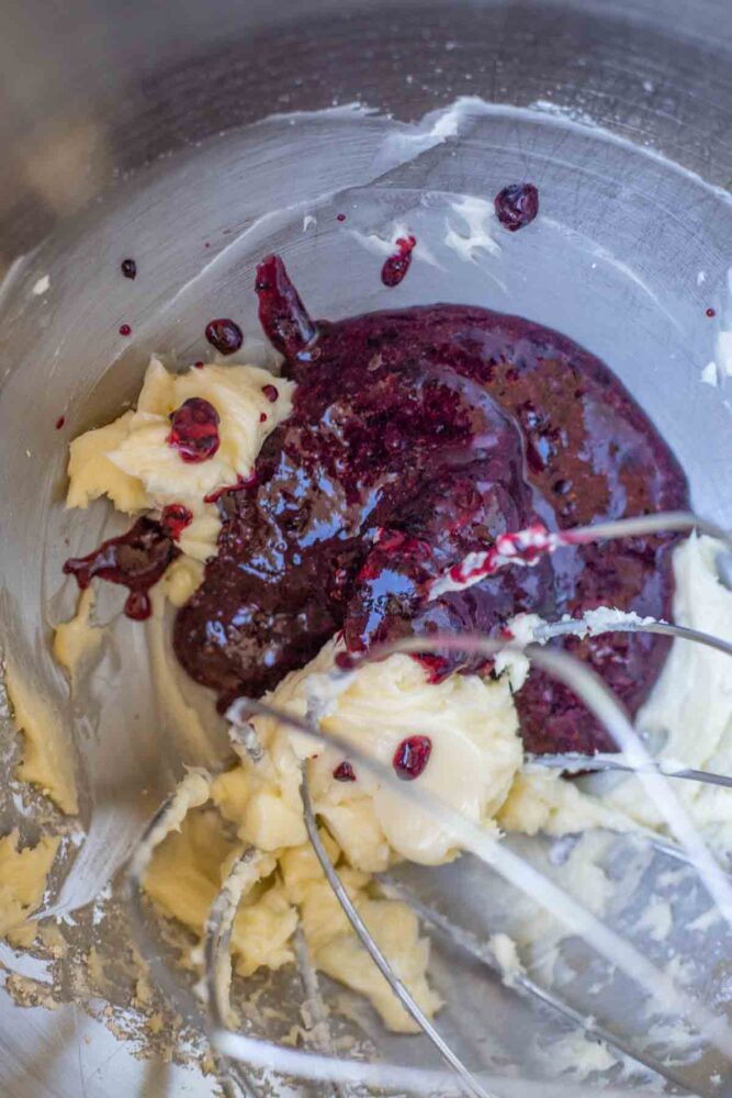 butter, pureed blueberries and powdered sugar in a bowl of stand mixer.