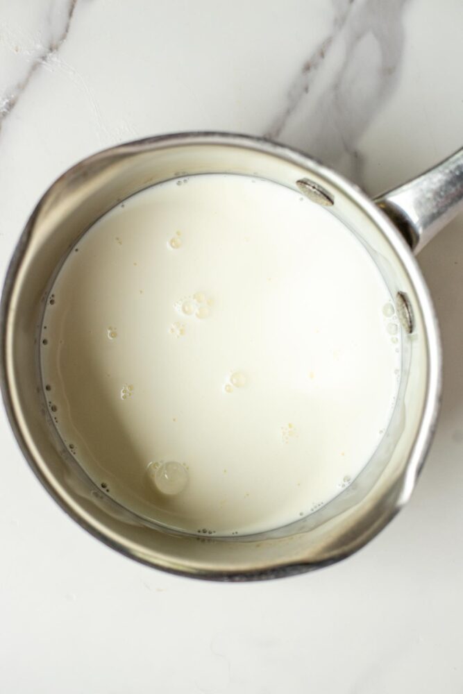Heating up milk in a saucepan.