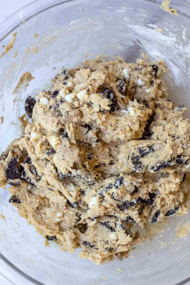 White chocolate chips and crushed sandwich cookies folded into cookie dough.