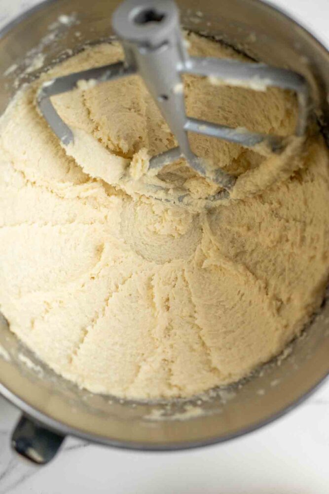 Creaming butter and sugar together in a stand mixer.
