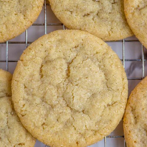 Close up of sourdough sugar cookies on a wire rack.